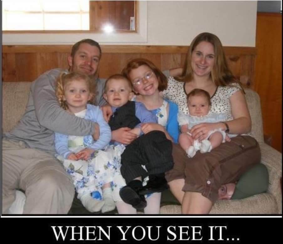 Can you identify the horrible secret that is concealed in this family picture?