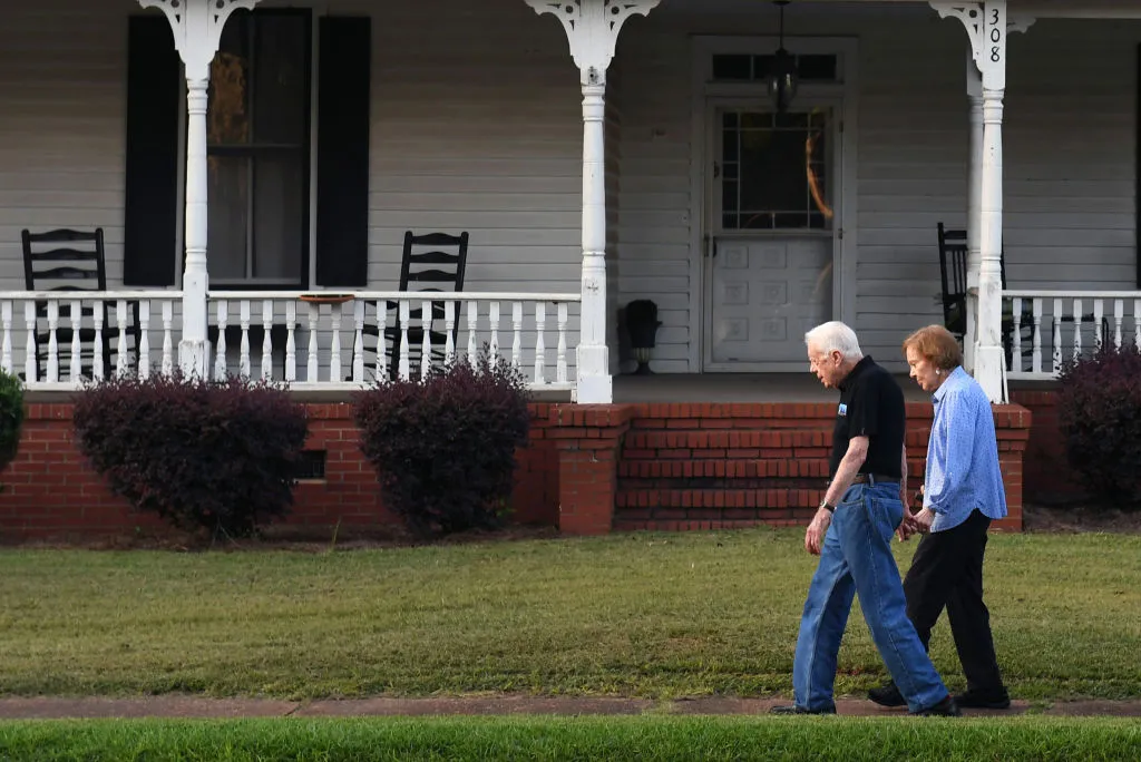 The former president Jimmy Carter lives in a house worth $210,000 and shops at the local Dollar General