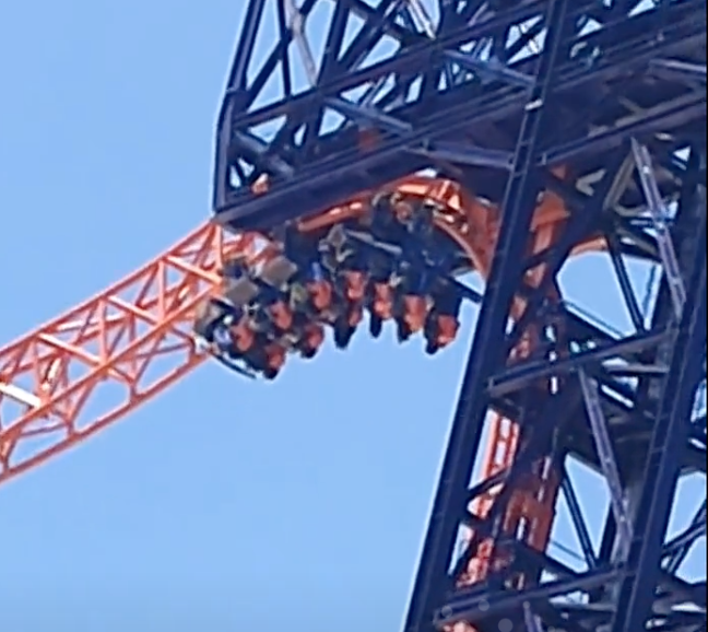 Tourists left hanging upside-down on roller coaster after power cut causes chaos at theme park