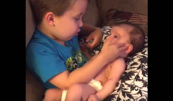 A Heartwarming Moment: A Brother Sings to his Baby Sister