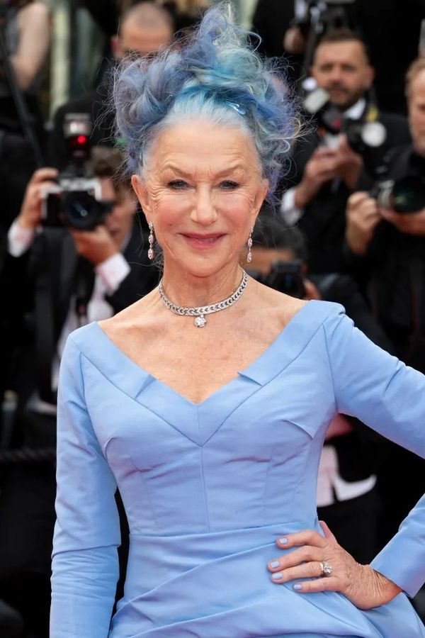 Helen Mirren with a hand fan